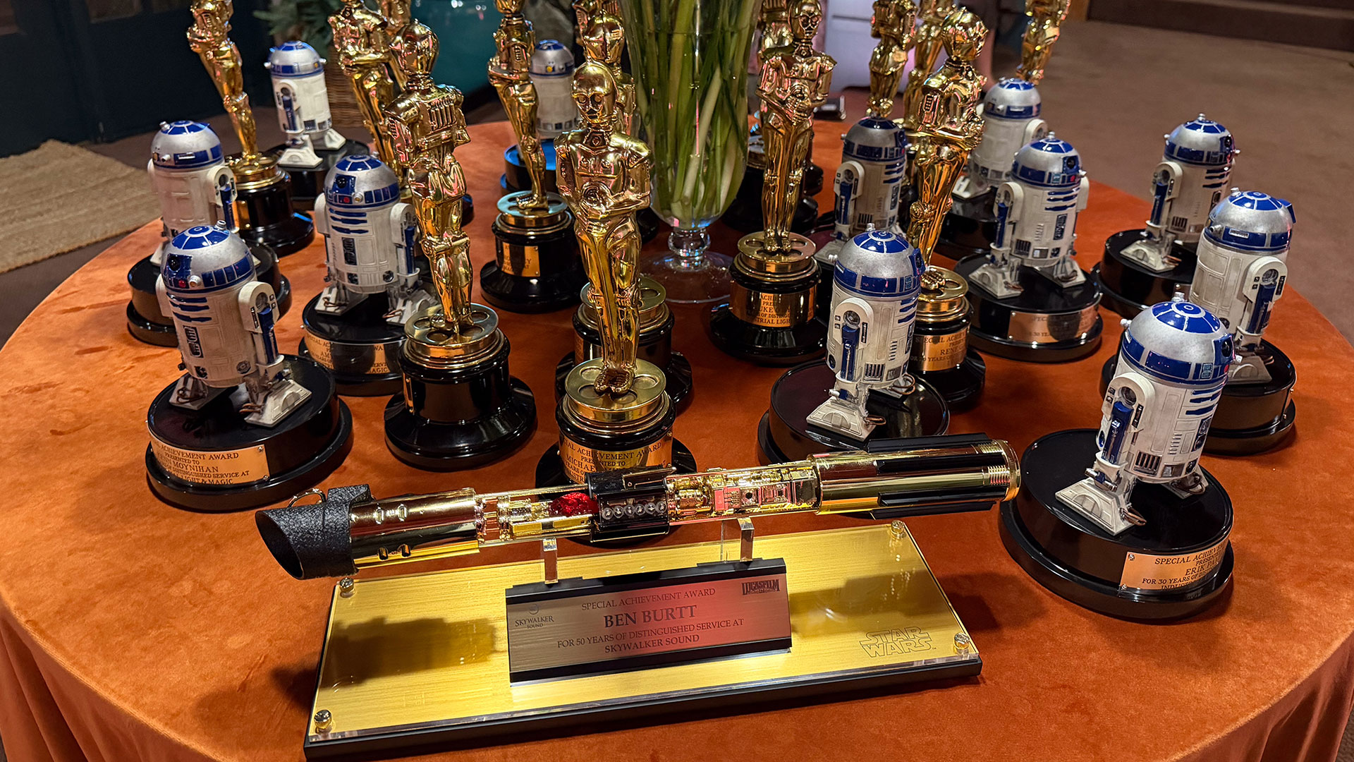 Lucasfilm Service Award trophies gathered on a table.