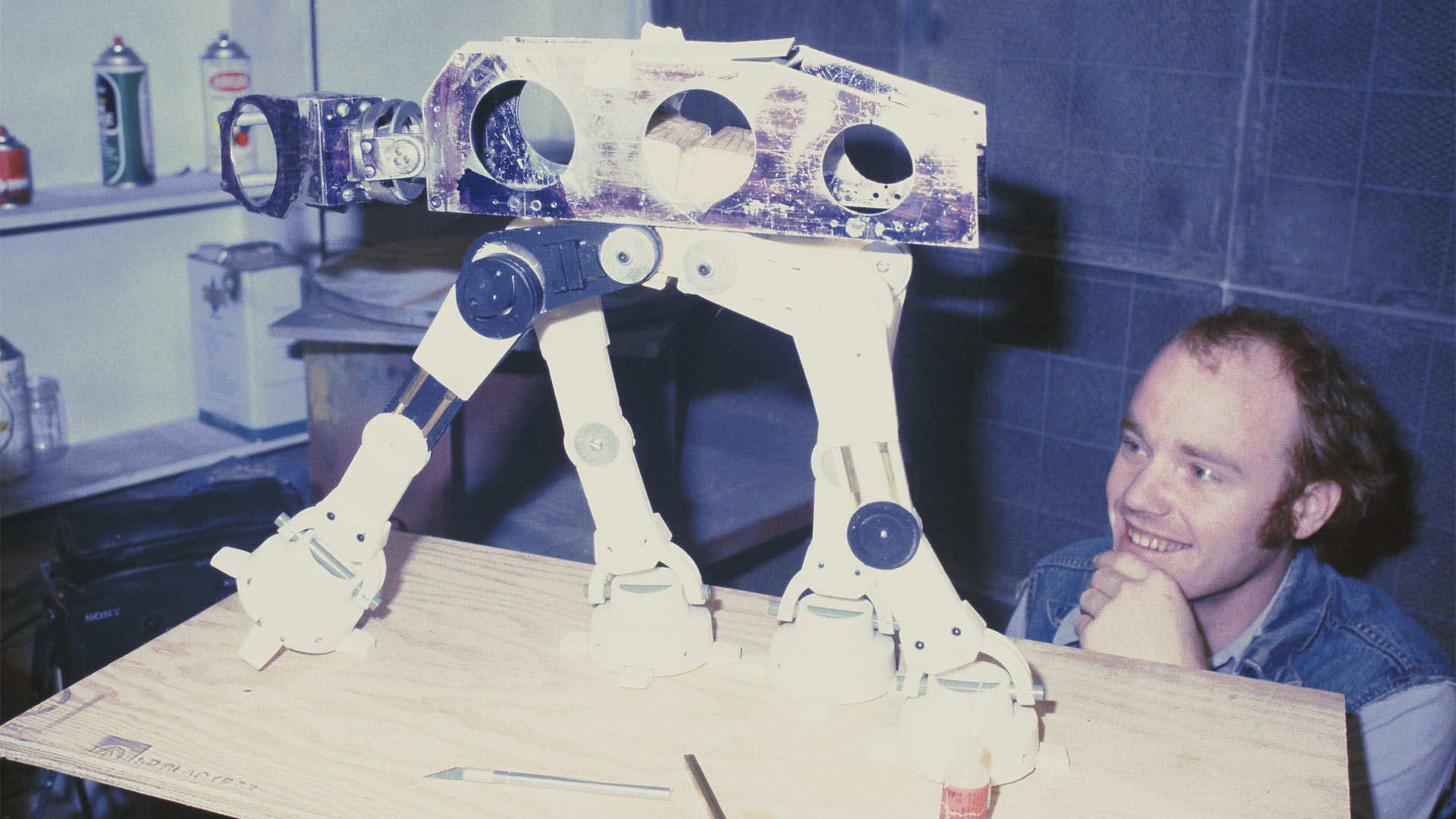 Phil Tippett with an in-progress walker puppet during production of Star Wars: The Empire Strikes Back.