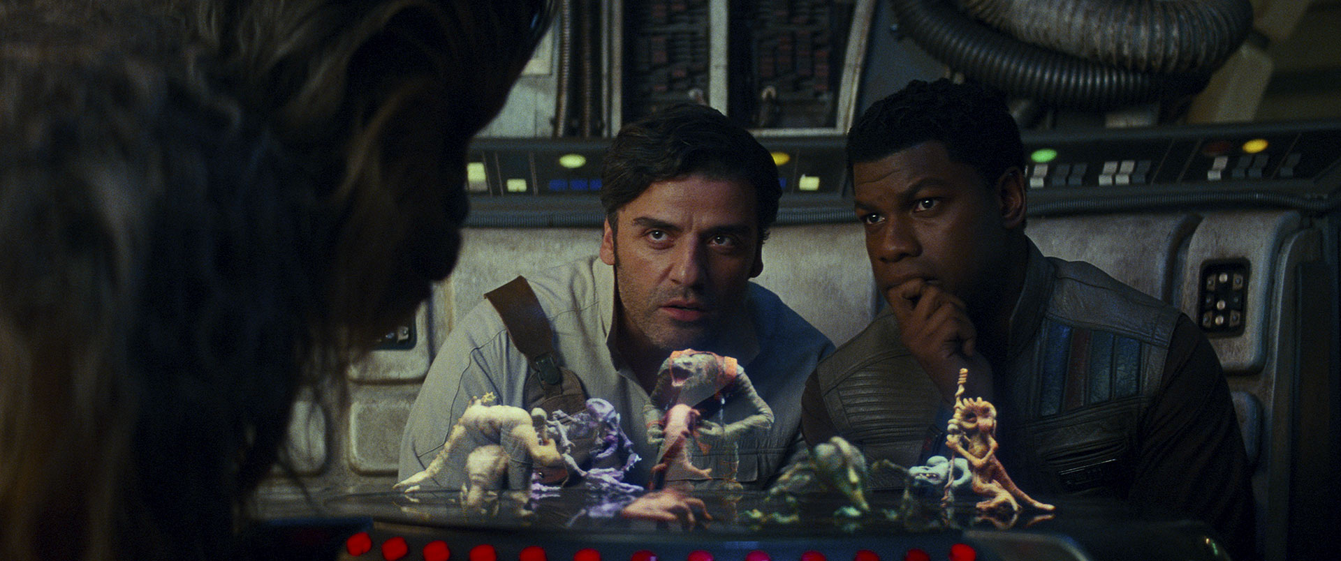 Poe and Finn play dejarik with Chewbacca.